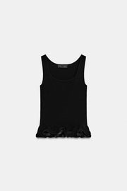 Top en maille à bas ondulé