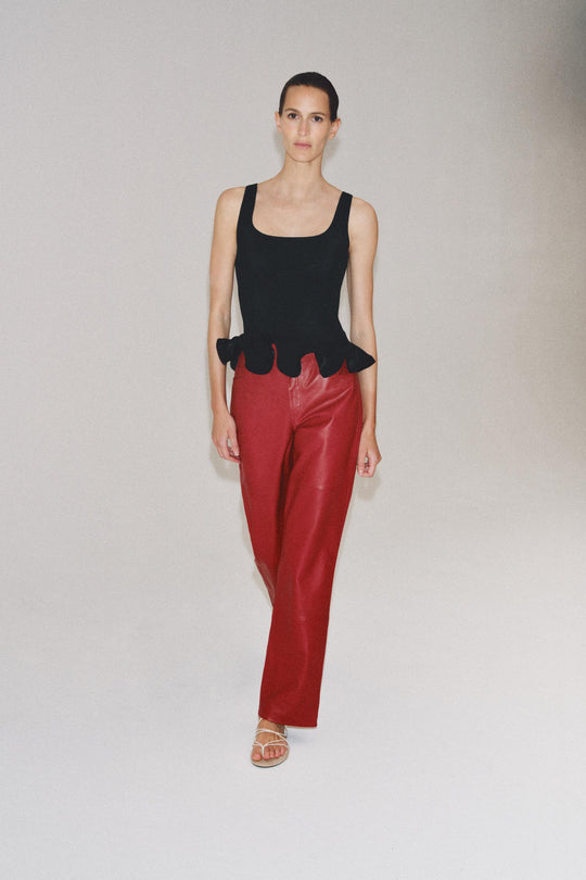 Top en maille à bas ondulé