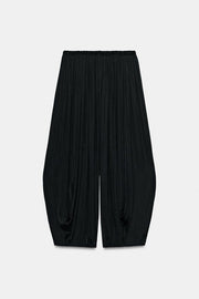 Pantalon bouffant à plis