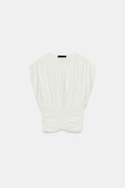 Top drapé en maille