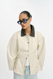 Blouson peplum à col contrasté