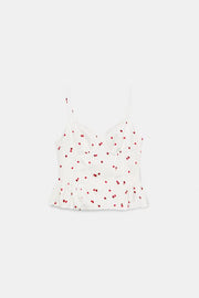 Top satiné à volants et motif fraises