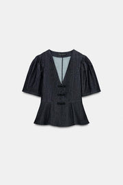 Top peplum à brandebourgs
