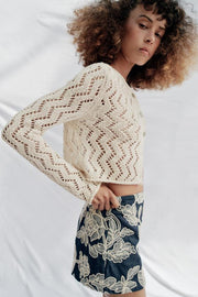 Veste en maille ajourée zigzag