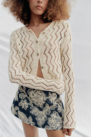 Veste en maille ajourée zigzag