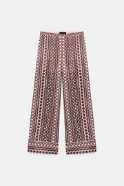 Pantalon large à broderies ajourées