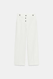 Pantalon à boutons métalliques