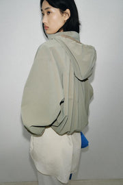 Blouson enduite à capuche