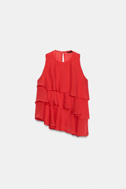 Top asymétrique à volants