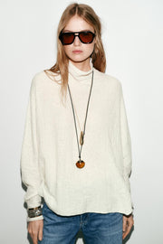 Pull effet cape en maille
