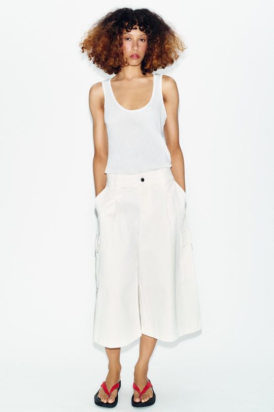 Top semi-transparent en maille contrastée