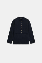 Veste en maille peplum à bouton doré
