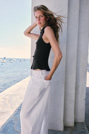 Top peplum à brandebourgs