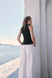 Top peplum à brandebourgs