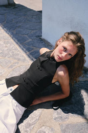 Top peplum à brandebourgs