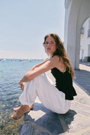 Top peplum à brandebourgs