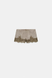 Short effet délavé en dentelle