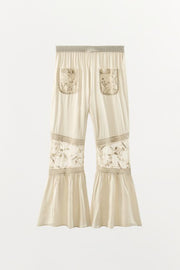 Pantalon contrasté à dentelle et broderies florales