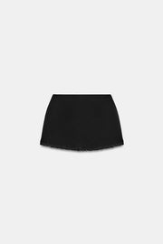 Jupe mini extensible en dentelle