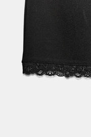 Jupe mini extensible en dentelle