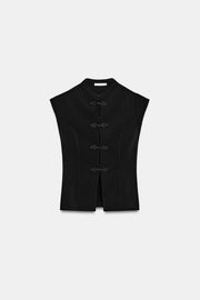 Top extensible à brandebourgs