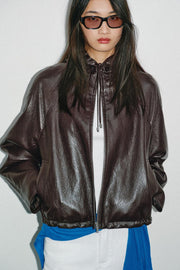 Blouson effet cuir à capuche