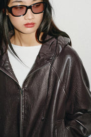 Blouson effet cuir à capuche