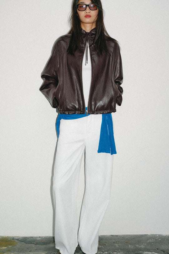 Blouson effet cuir à capuche