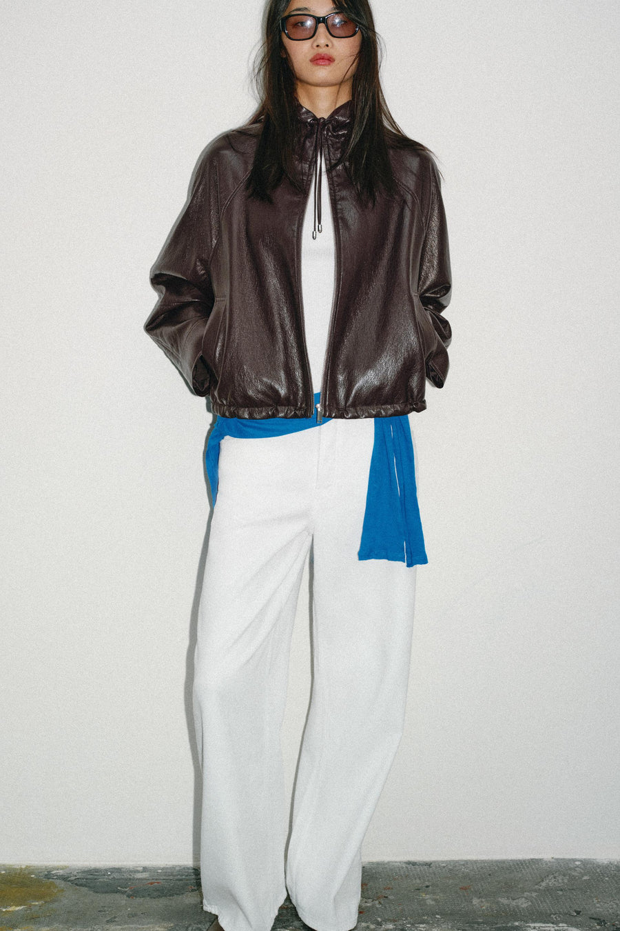 Blouson effet cuir à capuche