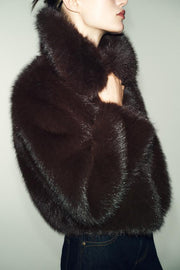 Manteau court effet fourrure à col revers