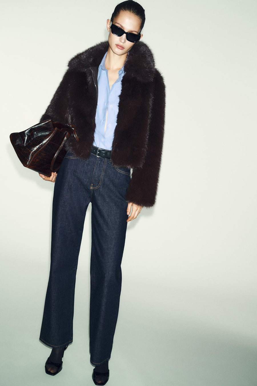 Manteau court effet fourrure à col revers