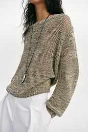 Pull en maille à fil métallisé