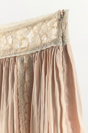 Jupe mini plissée en dentelle à perles