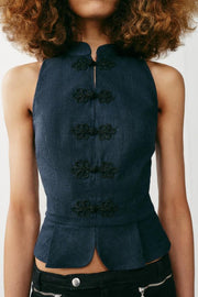 Top peplum à brandebourgs en lin