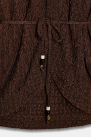 Veste avec ceinture effet froissé
