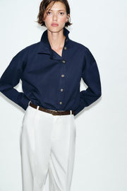Pantalon à pinces avec ceinture
